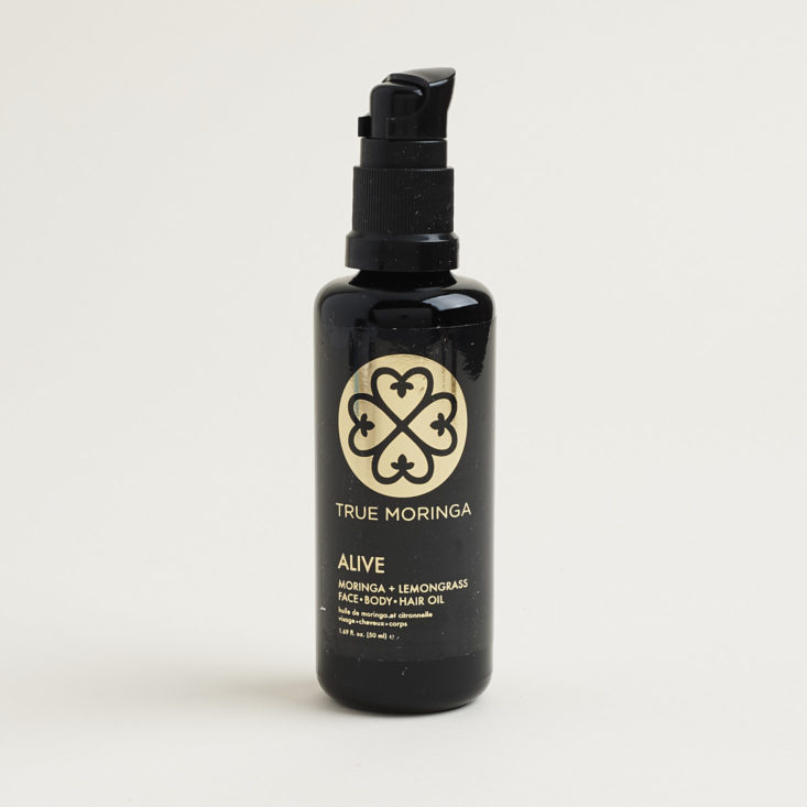 bottle of True Moringa Alive Face Hair and Body Oil