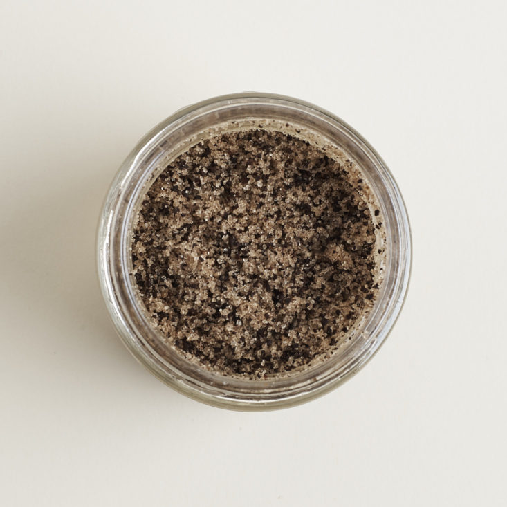 Overhead view inside a jar of True Moringa Rejuvenating Body Polish