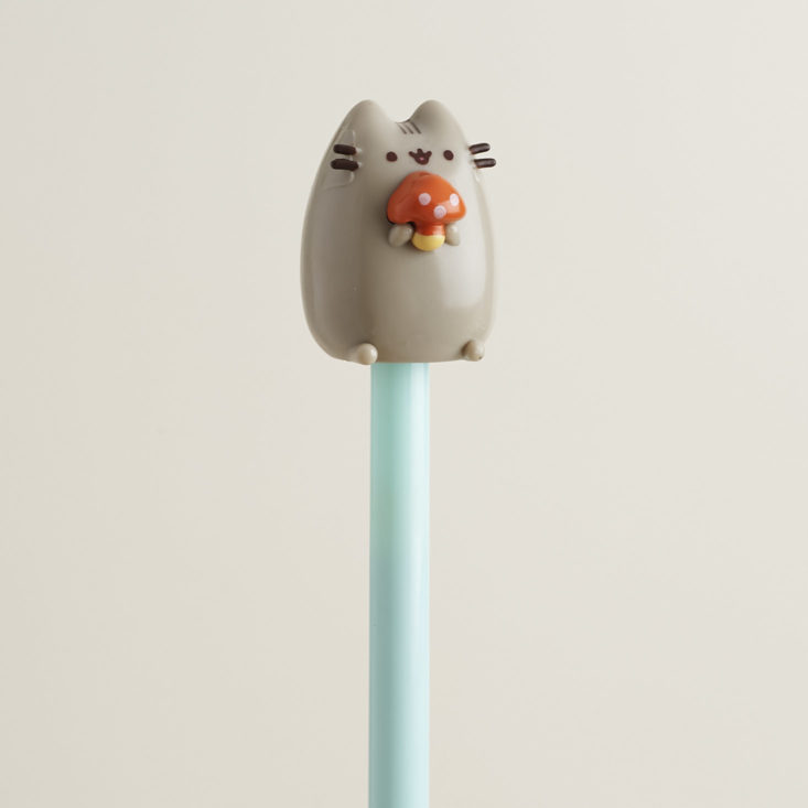Close up of Pen with Pusheen holding a mushroom on top