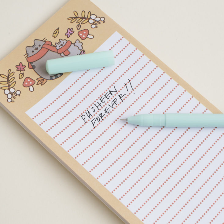 Close up of written text with pen that reads "Pusheen Forever!"