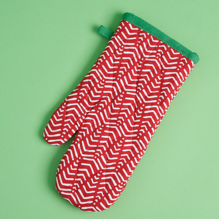 red patterned oven mitt