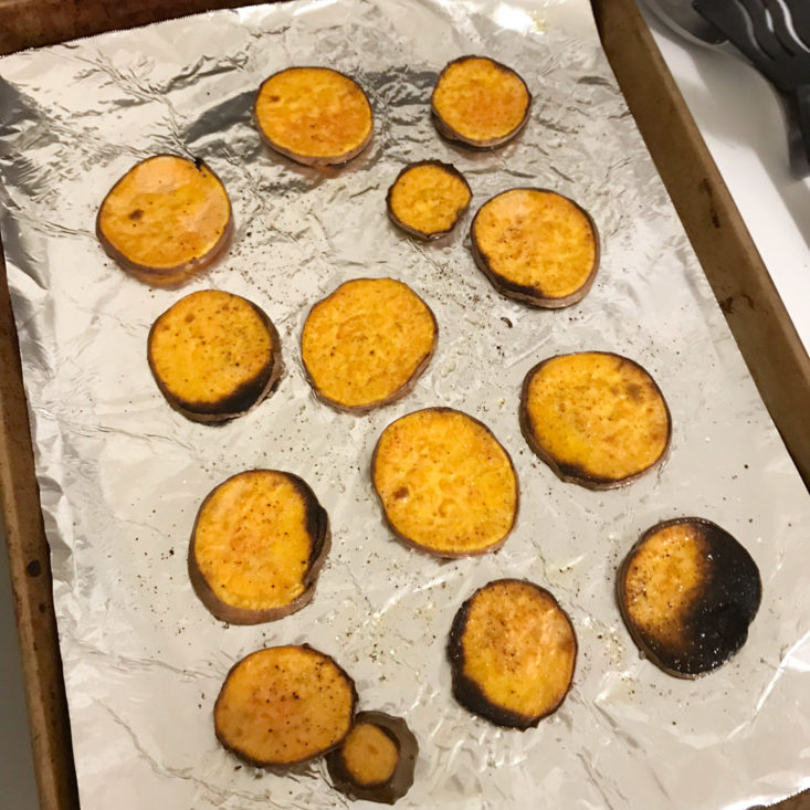 cooked sliced sweet potatoes on a baking sheet