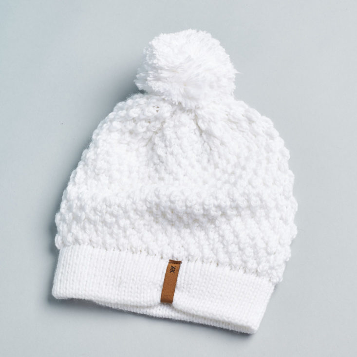white hat with pompom
