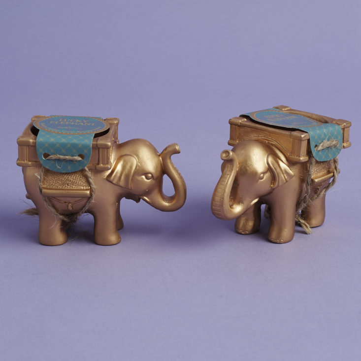 a pair of elephant votive candle holders