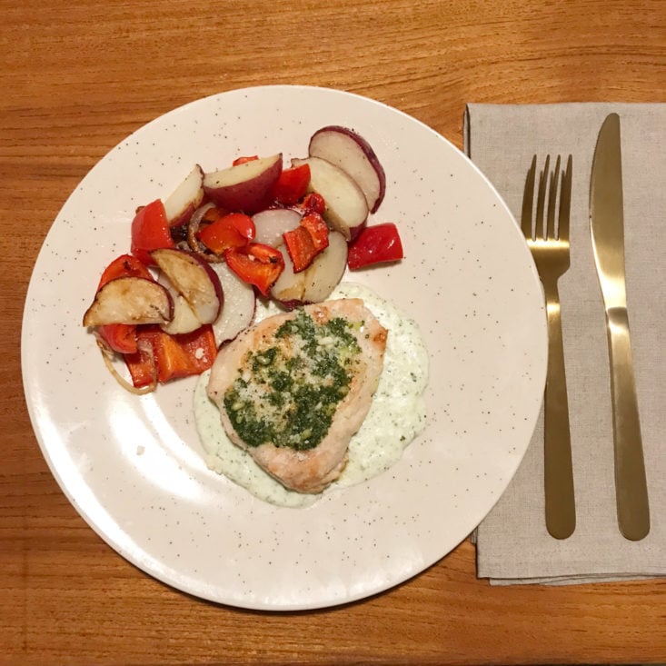 finished chicken with basil-pecorino cream sauce with roasted red potatoes and red peppers