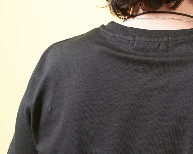 black tshirt with embroidered numbers