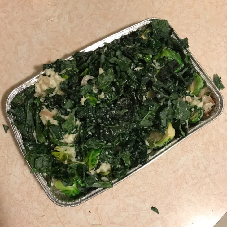 cooked brussels sprouts with sliced shallots in tin, mixed with cream, fontina, and kale