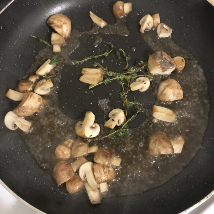 mushrooms, thyme, and verjus in pan