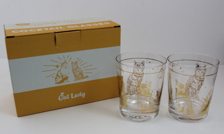 pair of clear short glasses with cat graphic