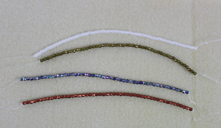 four strands of small beads