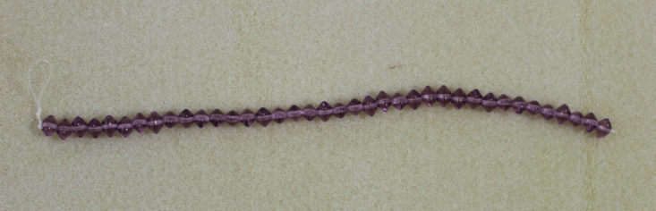 purple saucer beads on a string
