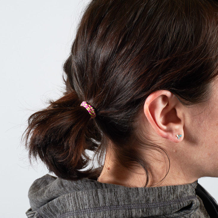 small neon hair tie in a pigtail