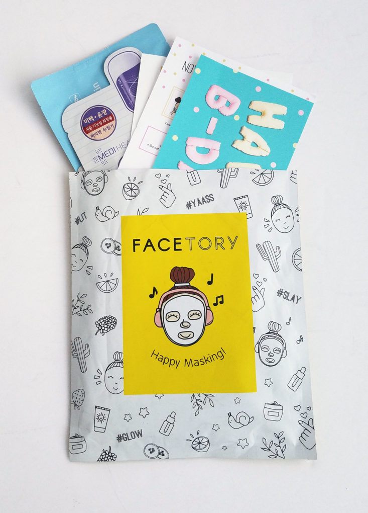 Facetory envelop with masks popping out