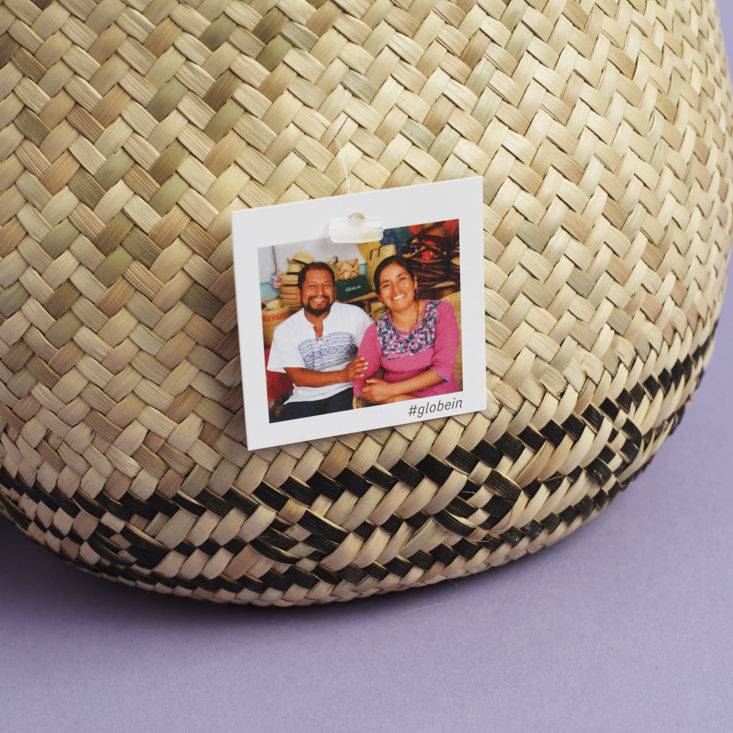close up of palm leaf basket and tag of artisan makers