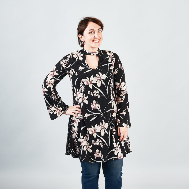 Trying out the dress-over-jeans trend in this floral print knit dres