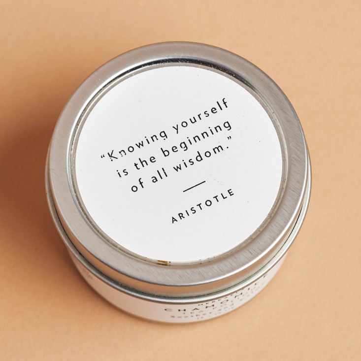 saying on the top of a lid of chamomile tea tin