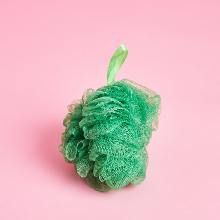 A green puffy loofah