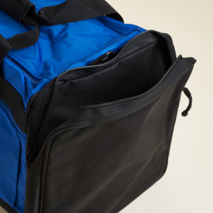 pocket on side of blue bag