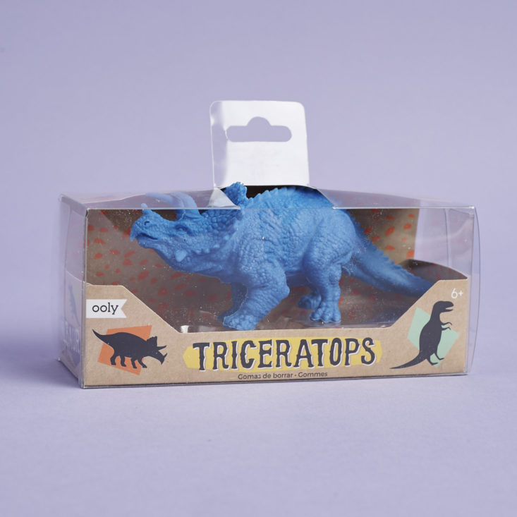 an oversized blue triceratops-shaped eraser in its clear package