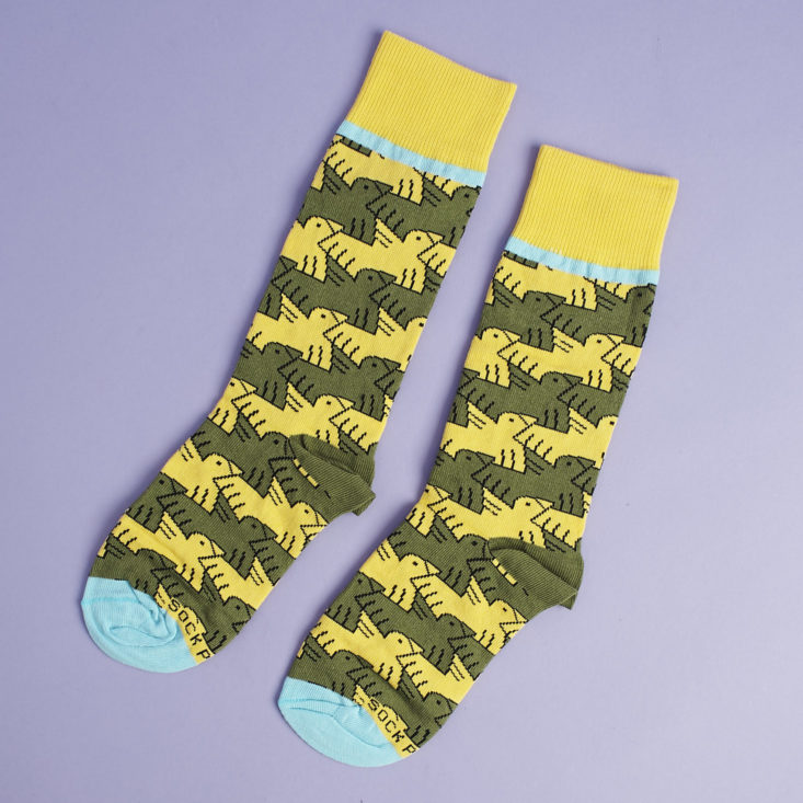 other side of socks with yellow and green bird pattern and aqua blue toes