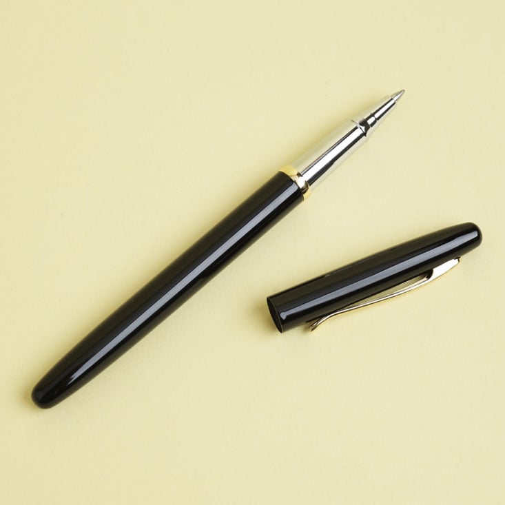 black and gold executive pen with cap off
