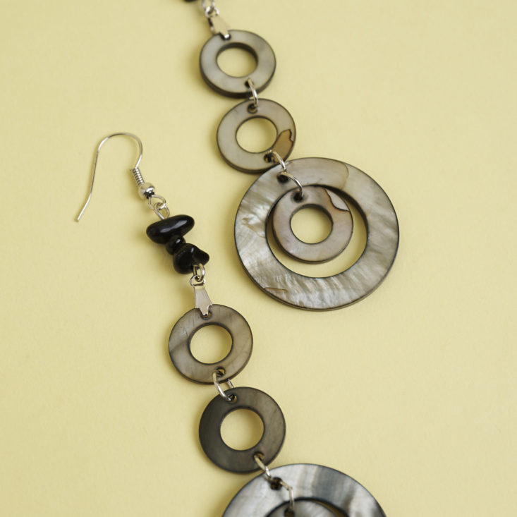 close up of pearly dangly circle earrings