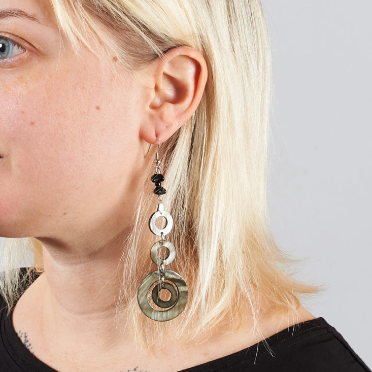 pearly dangly circle earrings on model