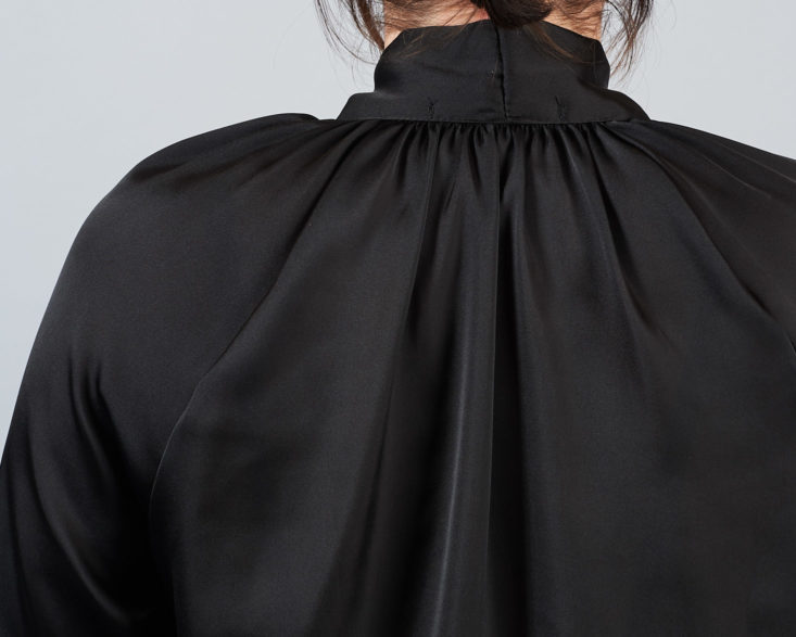 closeup on back of black blouse