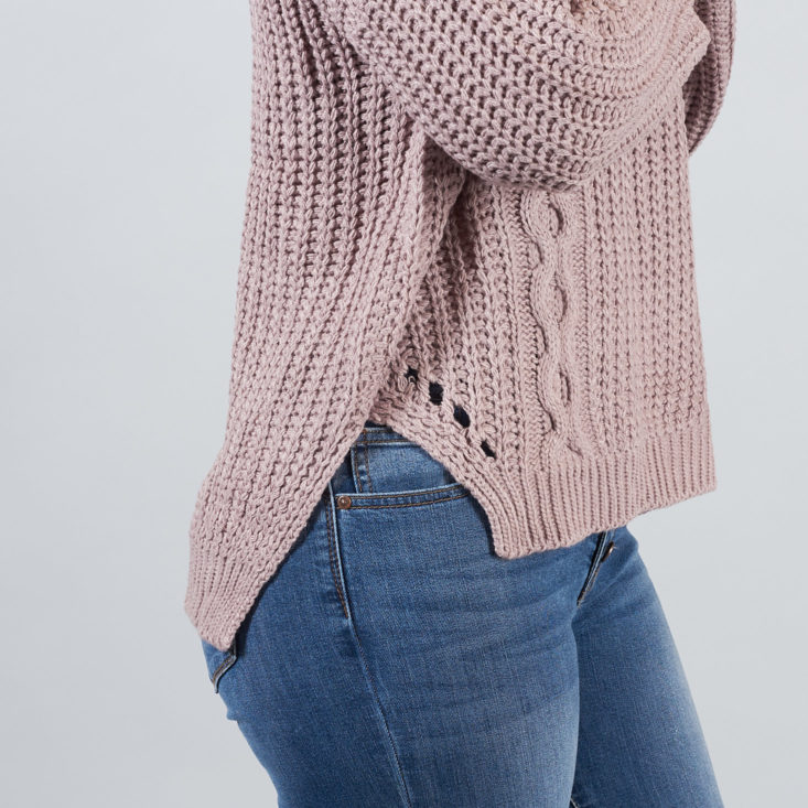 high-low hemline on lilac sweater
