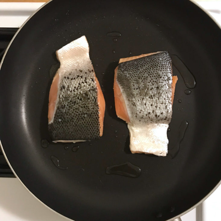 salmon skin side up in frying pan