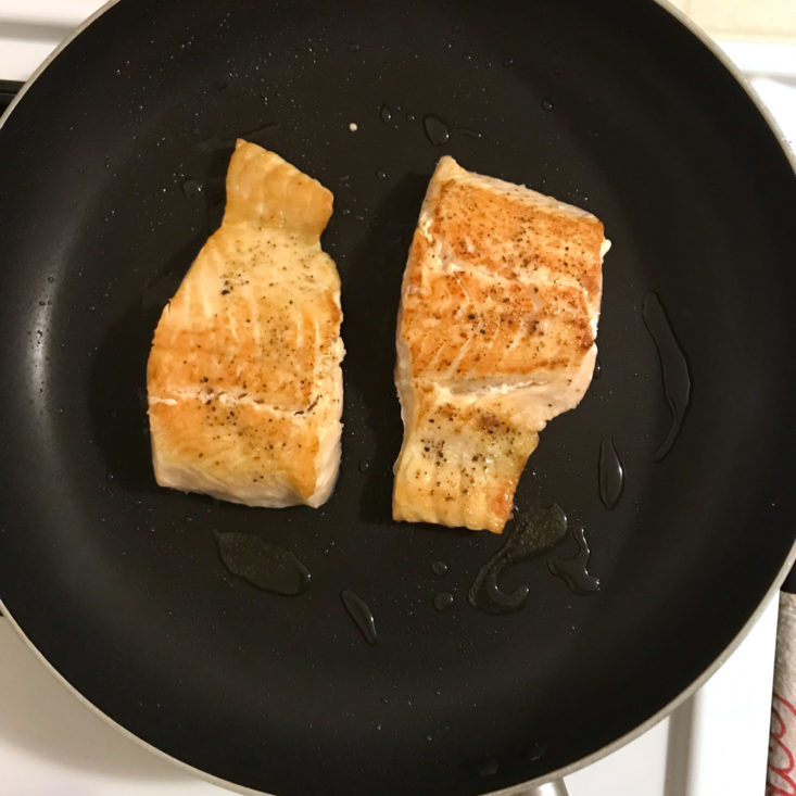 salmon skin side down in frying pan