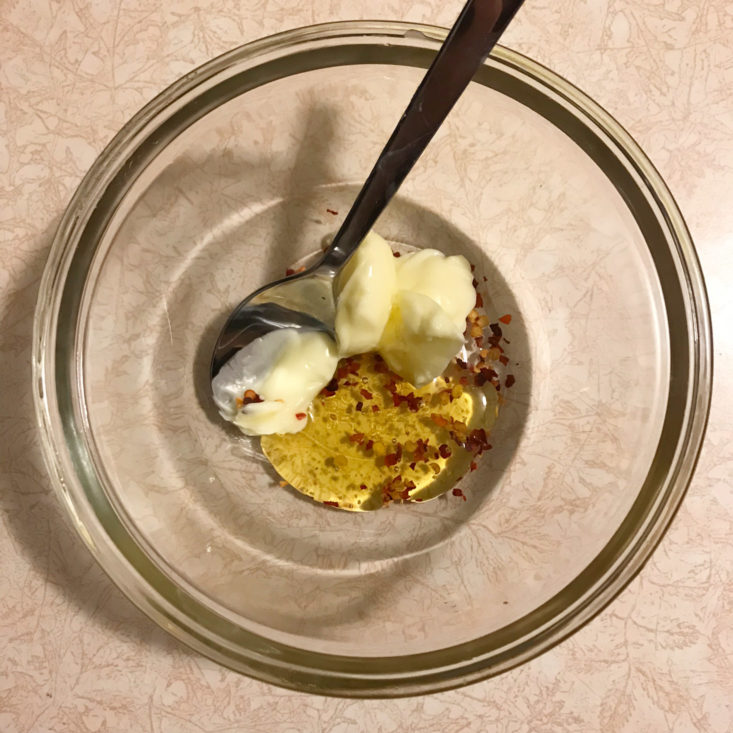 butter, honey and red pepper flakes in bowl
