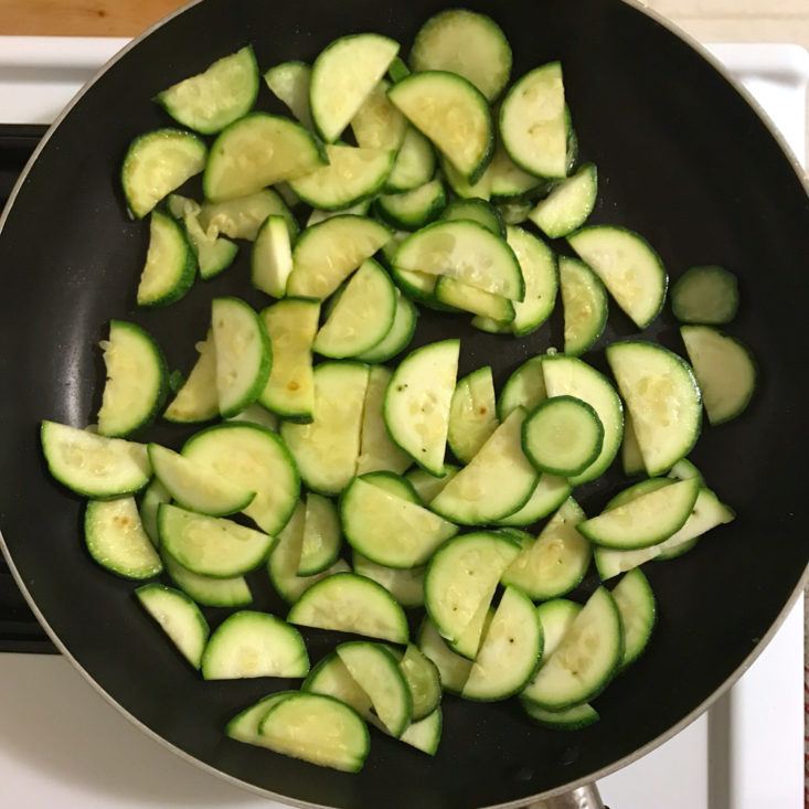 zucchini cooking in frying pan
