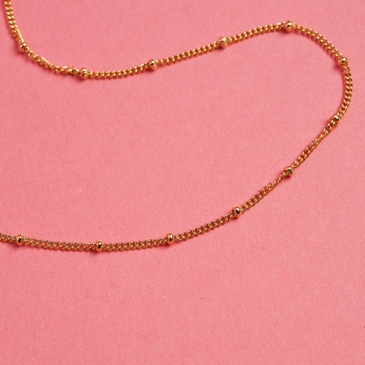 closeup on gold necklace