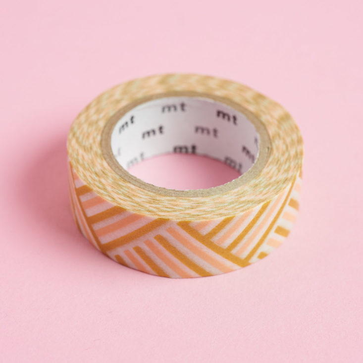 mt Washi Tape in gold and pink striped pattern, unwrapped