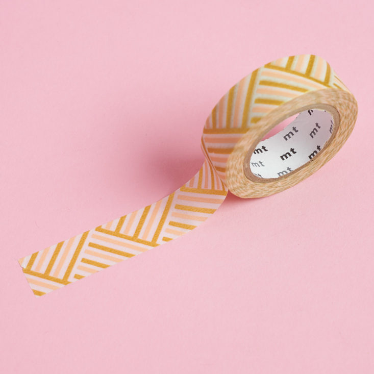 mt Washi Tape in gold and pink striped pattern, unrolled
