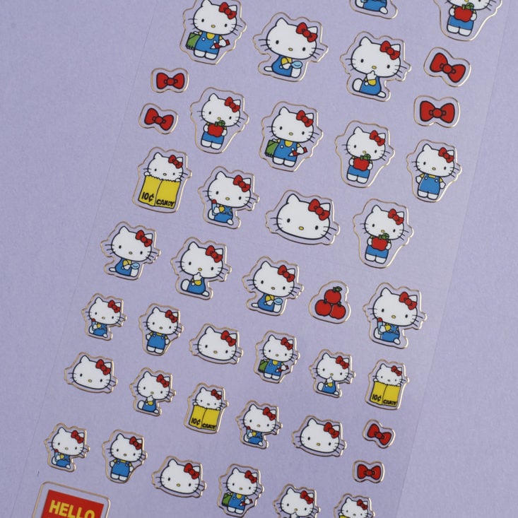 close up of Hello Kitty Stickers with metallic gold trim