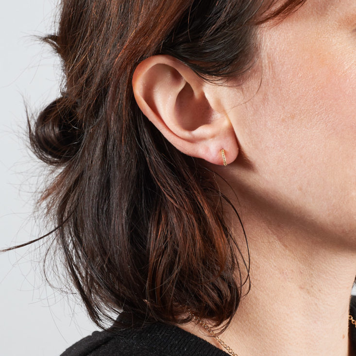 small earrings on model