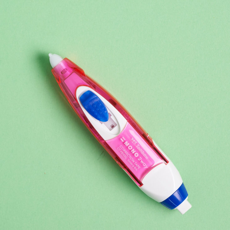 pink and blue corrector pen with button