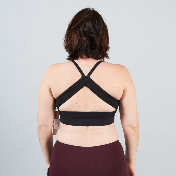 black mesh back of burgundy sports bra