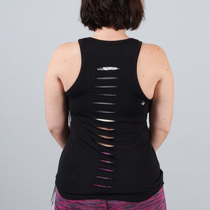 cutouts on the back of a black tank top