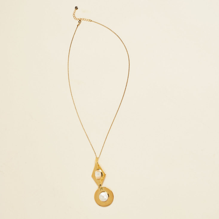 gold pendant necklace with geometric shapes