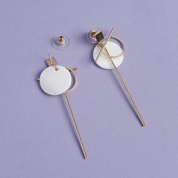 back and front of Gold and mother of pearl pearl geometric dangly earrings