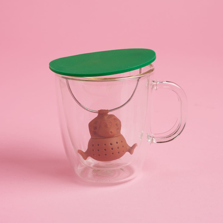 tea infuser shaped like a monkey in a cup