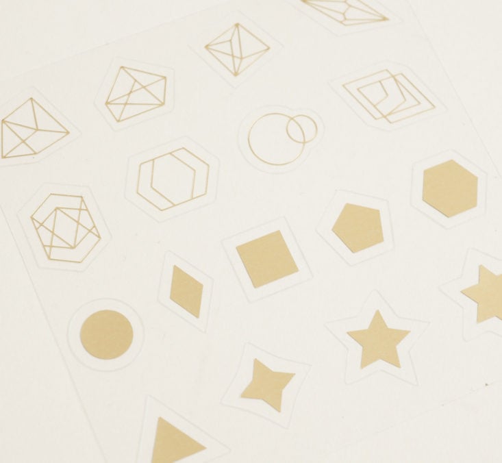 close up of gold foil geometric shape stickers