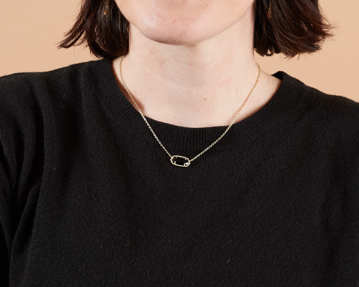 black pendant necklace on model