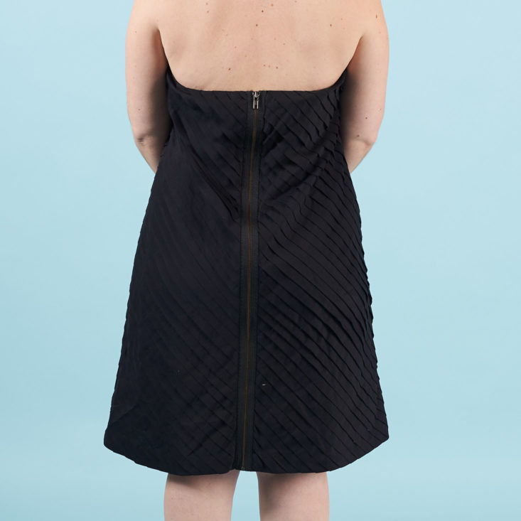 thred up march 2018 black dress from behind