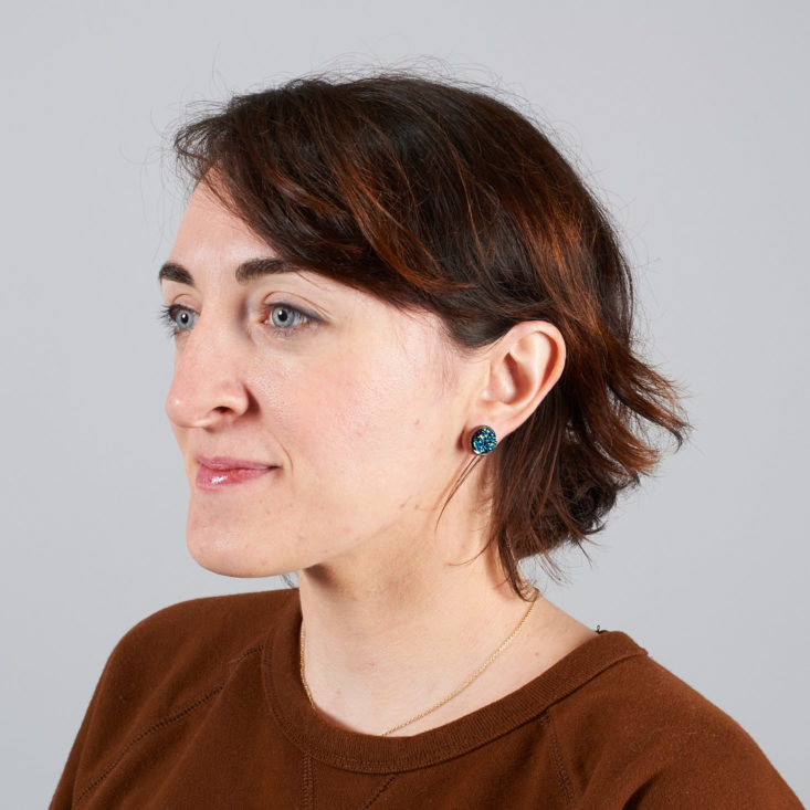 blue druzy earrings on model