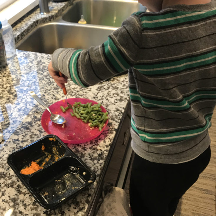 Toddler eating veggies