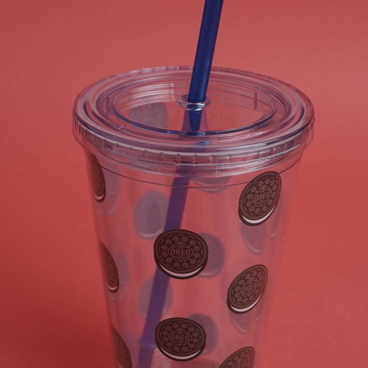 close up of Plastic OREO patterned reusable drink cup with straw